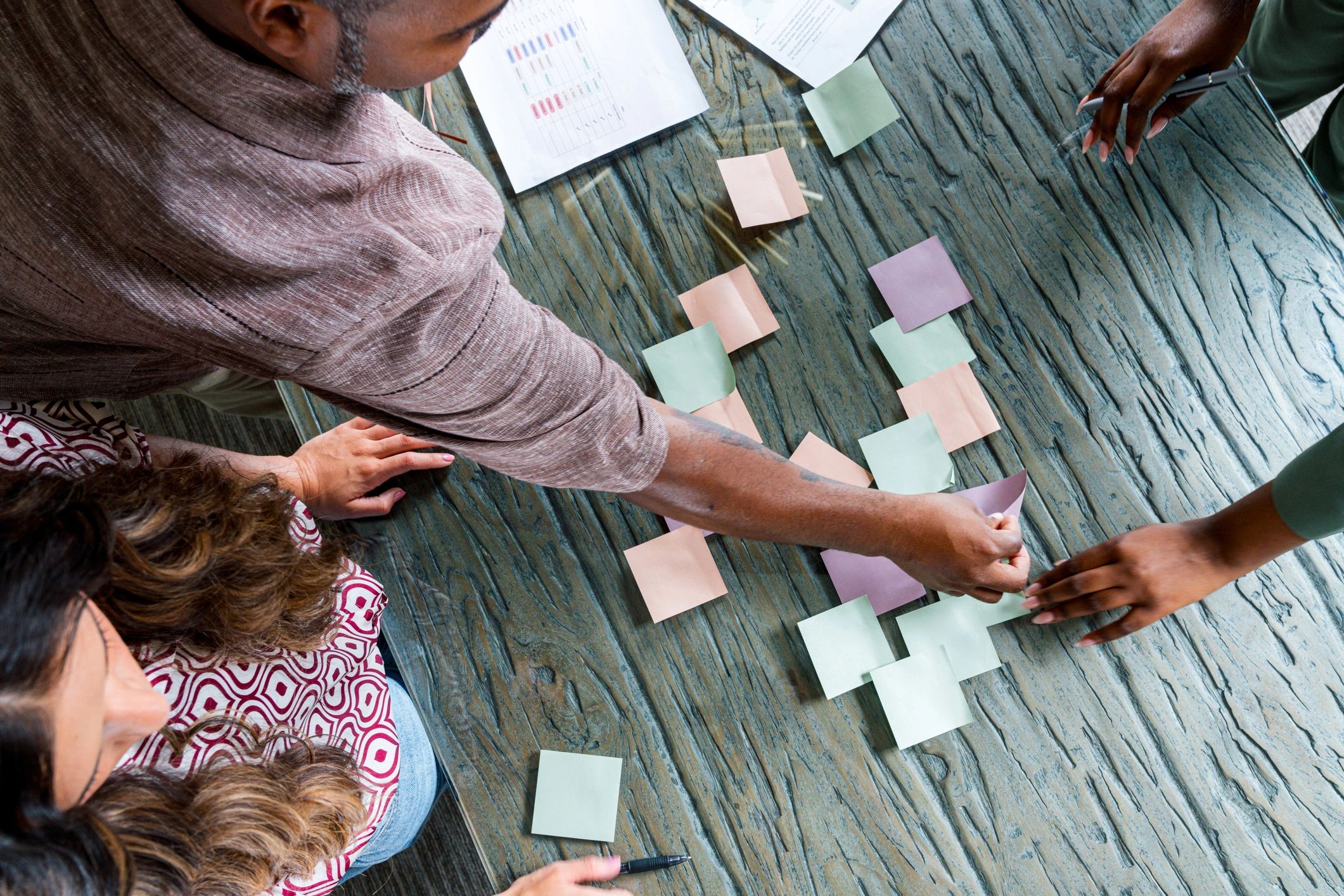 Team collaborating and organizing ideas with sticky notes